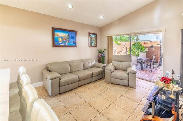 15763 SW 82nd St, Miami, FL 33193 - living room featuring vaulted ceiling, light tile patterned floors, recessed lighting, and baseboards