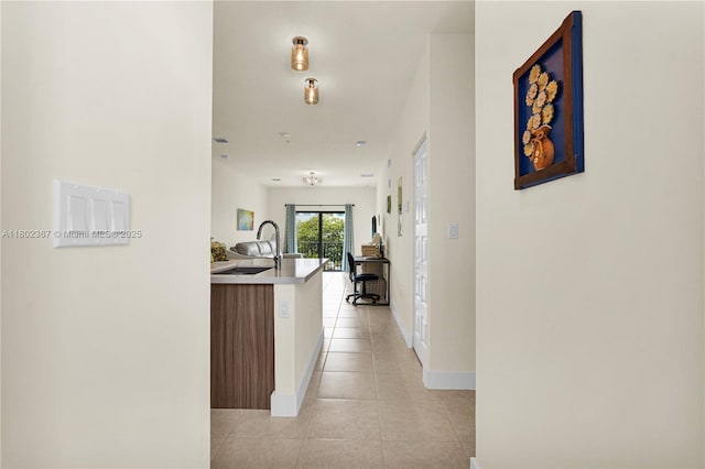 8301 NW 41st St Unit B-303, Doral, FL 33166 - corridor with light tile patterned flooring and a sink