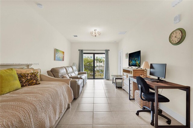 8301 NW 41st St Unit B-303, Doral, FL 33166 - bedroom with access to exterior, light tile patterned floors, and a desk