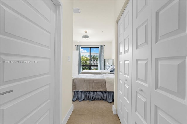 8301 NW 41st St Unit B-303, Doral, FL 33166 - hallway with light tile patterned floors and baseboards