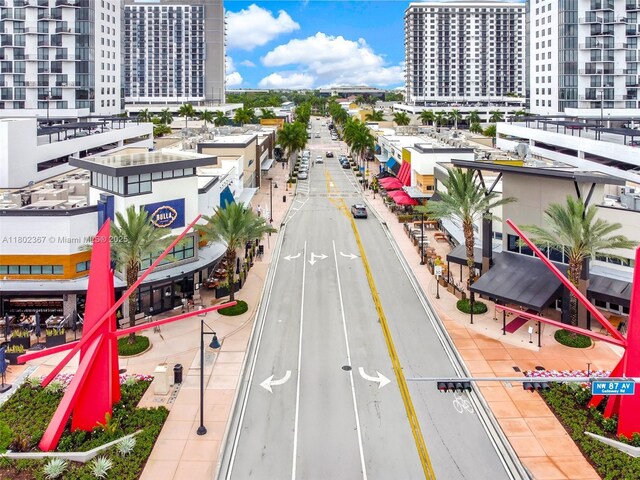 8301 NW 41st St Unit B-303, Doral, FL 33166 - view of asphalt road with sidewalks, a city view, and curbs