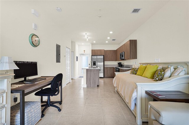 8301 NW 41st St Unit B-303, Doral, FL 33166 - bedroom with stainless steel fridge with ice dispenser, an office area, light tile patterned floors, electric panel, and recessed lighting