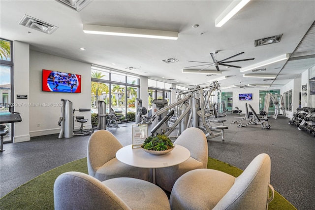 8301 NW 41st St Unit B-303, Doral, FL 33166 - gym with healthy amount of natural light, ceiling fan, recessed lighting, and expansive windows