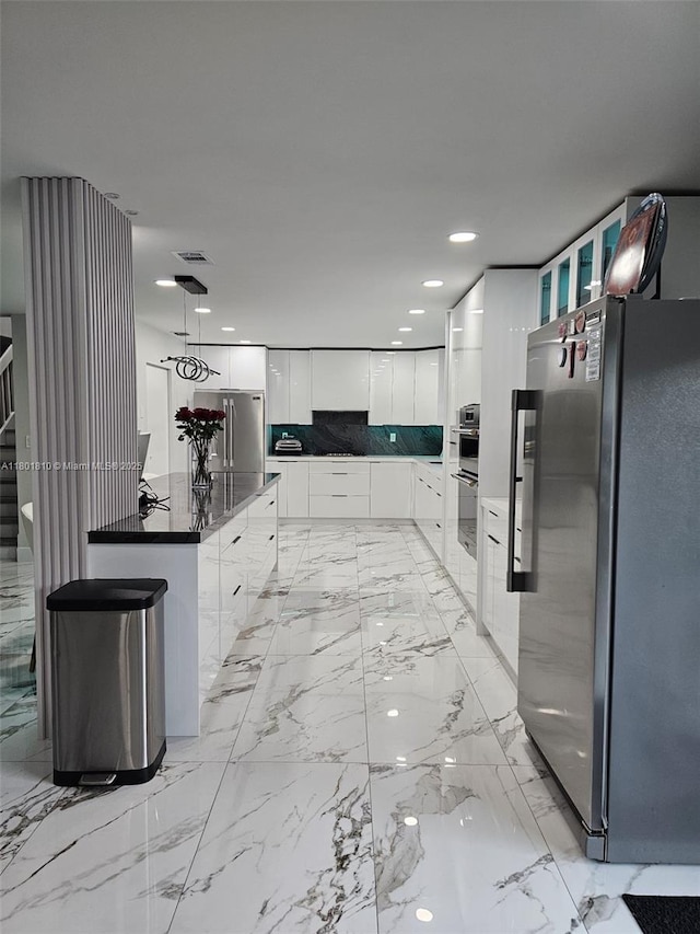 19110 NW 88th Ct, Hialeah, FL 33018 - kitchen with appliances with stainless steel finishes, modern cabinets, white cabinets, backsplash, and glass insert cabinets