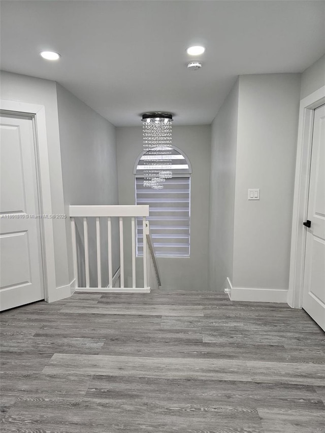 19110 NW 88th Ct, Hialeah, FL 33018 - hallway featuring an upstairs landing, recessed lighting, wood finished floors, and baseboards