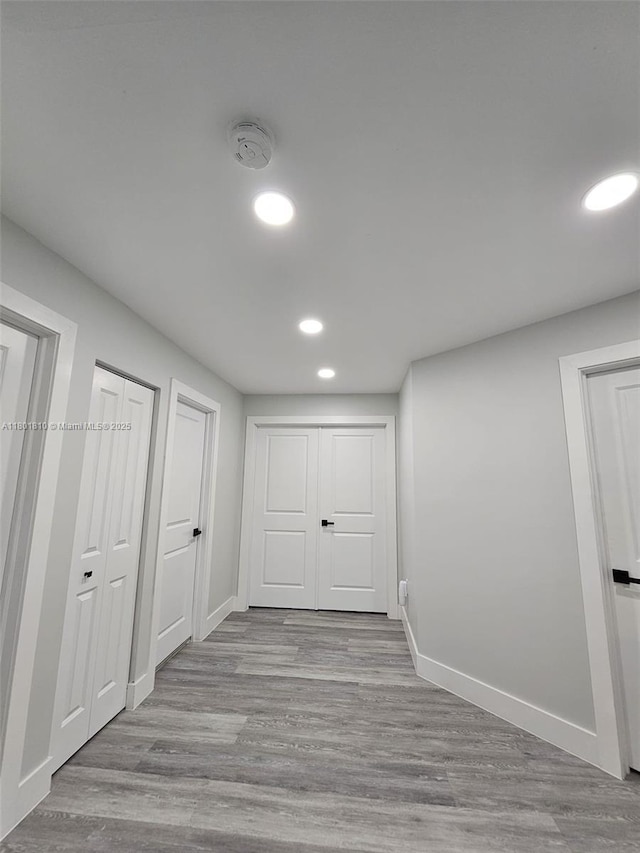 19110 NW 88th Ct, Hialeah, FL 33018 - below grade area featuring recessed lighting, baseboards, and wood finished floors