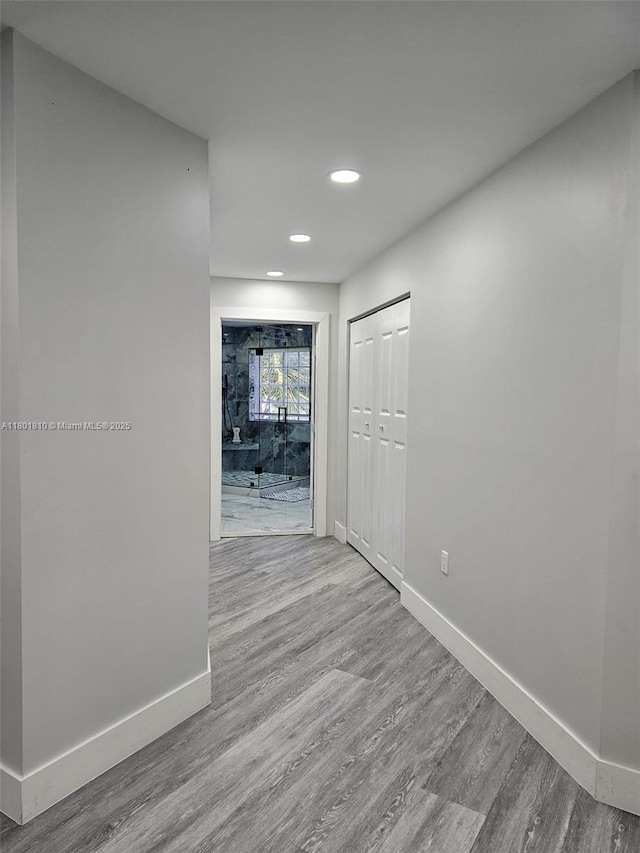 19110 NW 88th Ct, Hialeah, FL 33018 - hallway with baseboards, wood finished floors, and recessed lighting