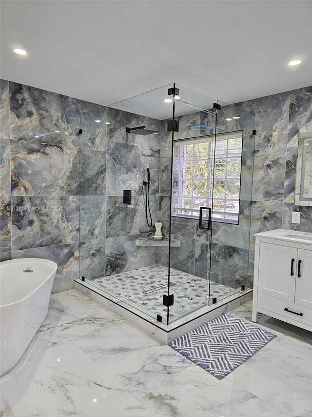 19110 NW 88th Ct, Hialeah, FL 33018 - full bath featuring marble tiled flooring, a marble finish shower, tile walls, a freestanding bath, and vanity