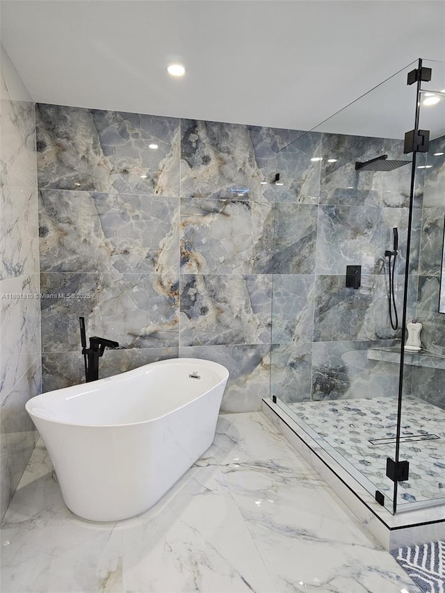 19110 NW 88th Ct, Hialeah, FL 33018 - bathroom with a marble finish shower, marble tiled flooring, a freestanding bath, recessed lighting, and tile walls