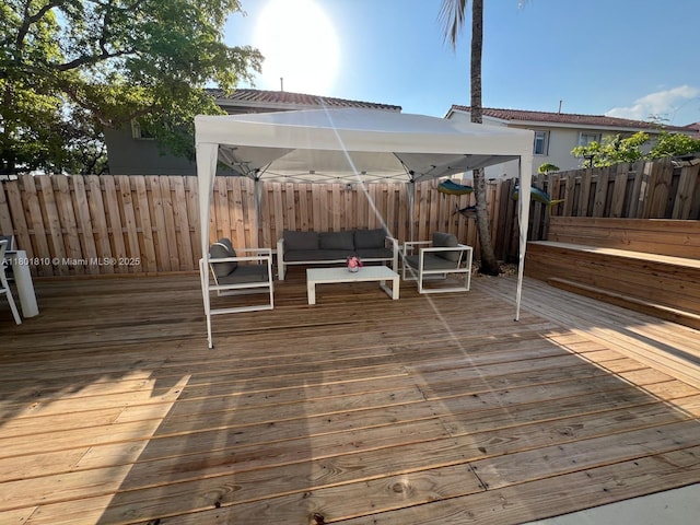 19110 NW 88th Ct, Hialeah, FL 33018 - deck with a gazebo, an outdoor hangout area, and fence