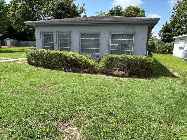 10354 SW 173rd St, Miami, FL 33157 - doorway to property with a lawn and stucco siding
