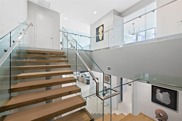 851 NE 1st Ave Ph 5401, Miami, FL 33132 - staircase featuring a high ceiling, a chandelier, and healthy amount of natural light