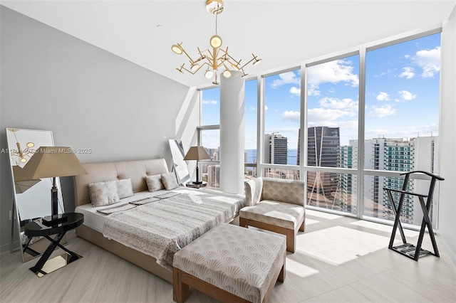851 NE 1st Ave Ph 5401, Miami, FL 33132 - bedroom featuring a chandelier, a wall of windows, and a view of city