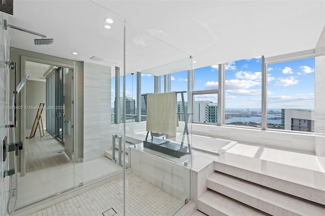 851 NE 1st Ave Ph 5401, Miami, FL 33132 - full bath featuring a view of city, tile patterned floors, a stall shower, and recessed lighting
