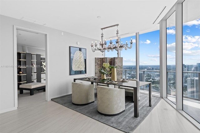 851 NE 1st Ave Ph 5401, Miami, FL 33132 - dining room with floor to ceiling windows, a chandelier, and wood finished floors