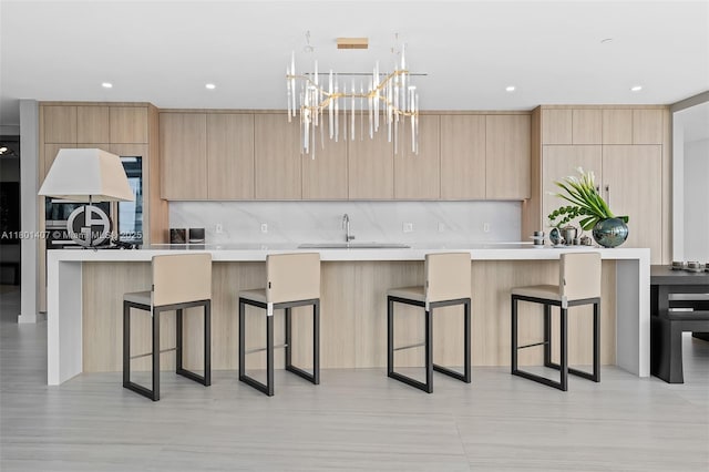 851 NE 1st Ave Ph 5401, Miami, FL 33132 - kitchen with light brown cabinetry, modern cabinets, a sink, and recessed lighting