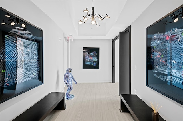 851 NE 1st Ave Ph 5401, Miami, FL 33132 - hallway featuring a chandelier and a raised ceiling