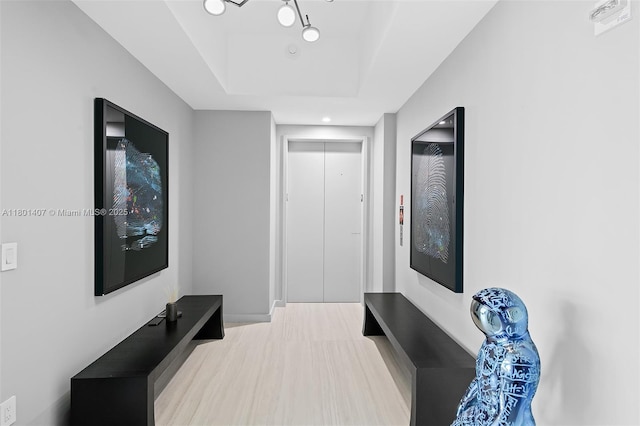 851 NE 1st Ave Ph 5401, Miami, FL 33132 - hallway featuring a tray ceiling, wood finished floors, baseboards, and recessed lighting