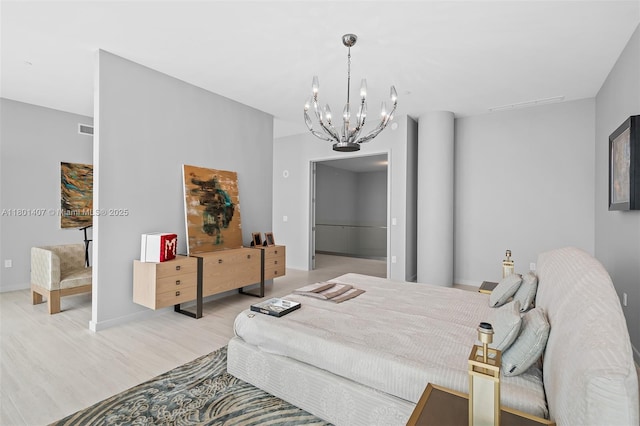 851 NE 1st Ave Ph 5401, Miami, FL 33132 - bedroom with a chandelier, light wood finished floors, and baseboards