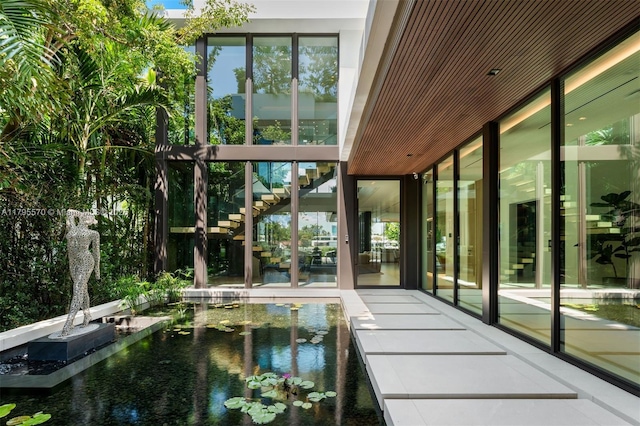 220 W Dilido Dr, Miami Beach, FL 33139 - unfurnished sunroom featuring a water view