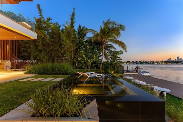 220 W Dilido Dr, Miami Beach, FL 33139 - view of patio featuring a water view and a dock