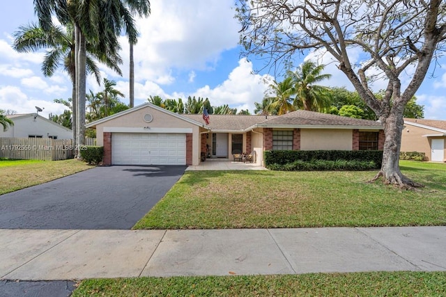single story home featuring driveway, an attached garage, stucco siding, and brick siding