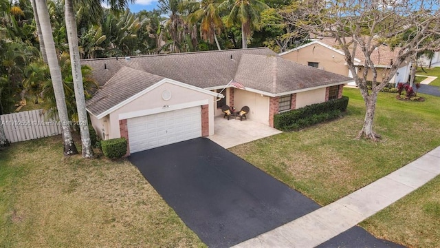 view of front facade featuring asphalt driveway, stucco siding, roof with shingles, and an attached garage