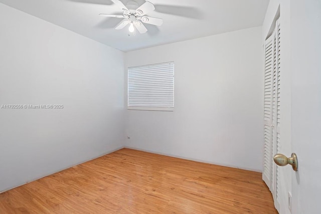 unfurnished bedroom featuring light wood finished floors and a ceiling fan