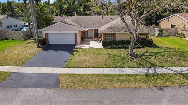 ranch-style house with driveway, a garage, and stucco siding