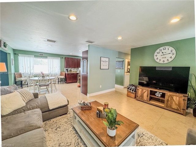 4002 Cascade Ln, La Belle, FL 33935 - living room featuring baseboards, recessed lighting, and light tile patterned floors