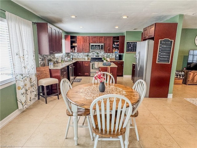 4002 Cascade Ln, La Belle, FL 33935 - dining room featuring light tile patterned flooring, recessed lighting, and baseboards