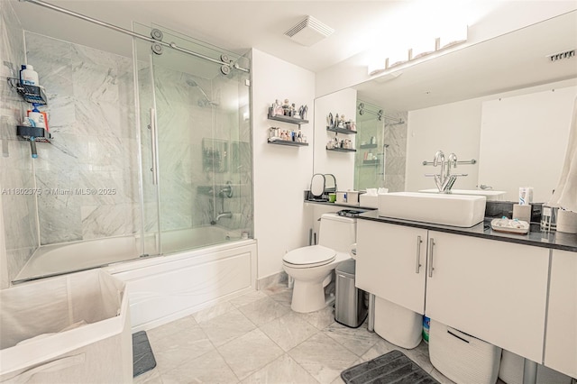 31 SE 5th St Unit 1603, Miami, FL 33131 - full bathroom featuring toilet, enclosed tub / shower combo, vanity, and marble look tiles
