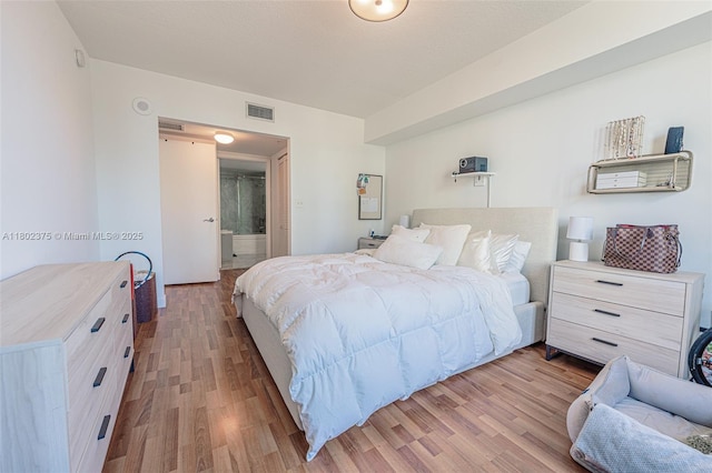 31 SE 5th St Unit 1603, Miami, FL 33131 - bedroom with wood finished floors and ensuite bath