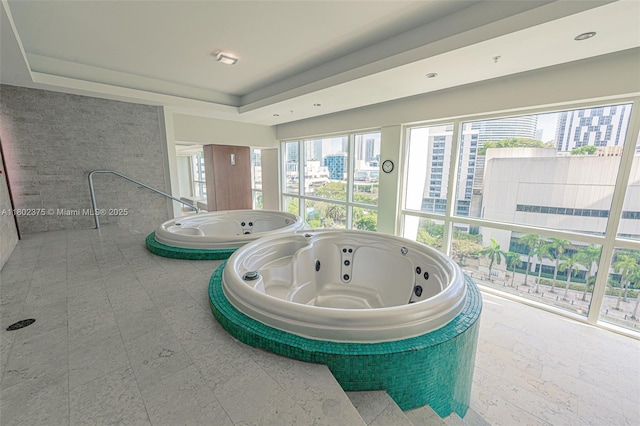 31 SE 5th St Unit 1603, Miami, FL 33131 - detailed view of a jacuzzi, a tray ceiling, and a city view