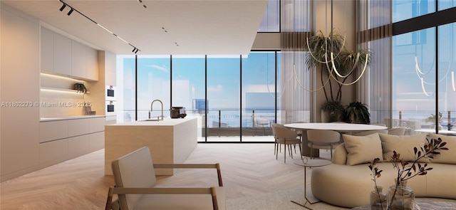 1000 Brickell Plz Unit Uph6201, Miami, FL 33131 - living room with expansive windows, a water view, and healthy amount of natural light