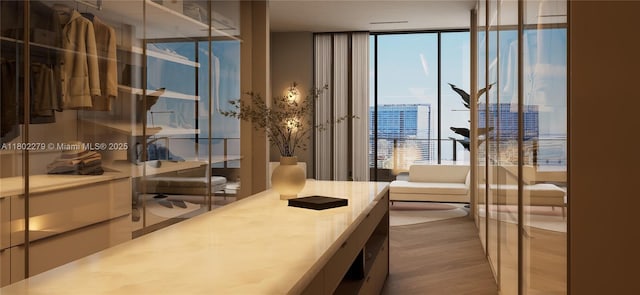 1000 Brickell Plz Unit Uph6201, Miami, FL 33131 - office featuring a wall of windows and wood finished floors