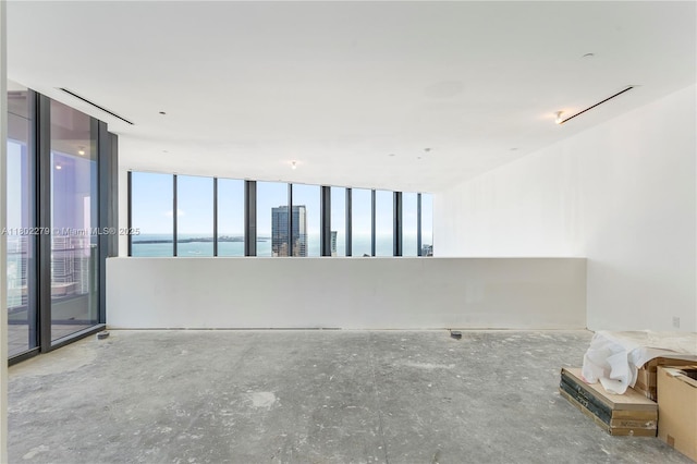 1000 Brickell Plz Unit Uph6201, Miami, FL 33131 - empty room featuring a water view and plenty of natural light