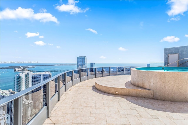 1000 Brickell Plz Unit Uph6201, Miami, FL 33131 - view of patio featuring a water view and a balcony