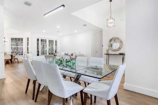 5530 SW 195th Ter, Southwest Ranches, FL 33332 - dining space with light wood-style flooring, a chandelier, and baseboards