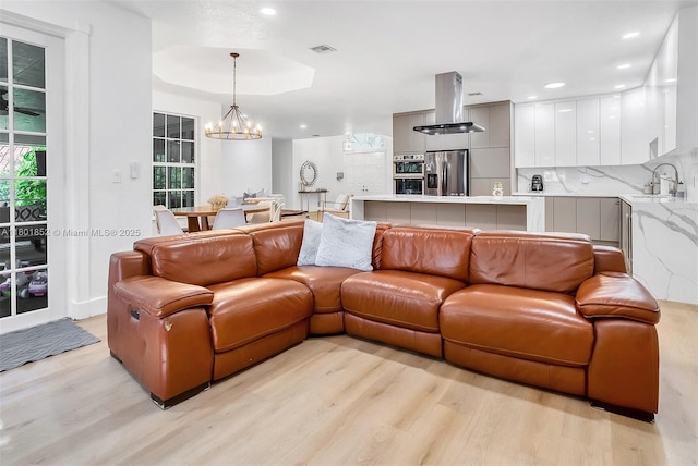 5530 SW 195th Ter, Southwest Ranches, FL 33332 - living room with light wood-style floors, a chandelier, and recessed lighting