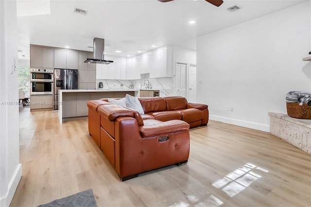 5530 SW 195th Ter, Southwest Ranches, FL 33332 - living room featuring light wood-style floors, a ceiling fan, baseboards, and recessed lighting