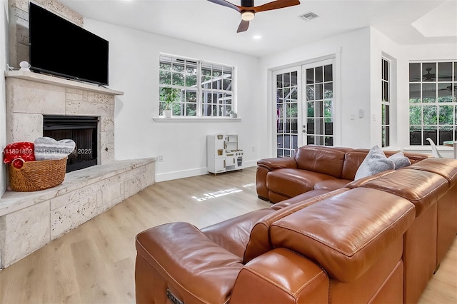 5530 SW 195th Ter, Southwest Ranches, FL 33332 - living area with a ceiling fan, wood finished floors, baseboards, a fireplace with raised hearth, and recessed lighting