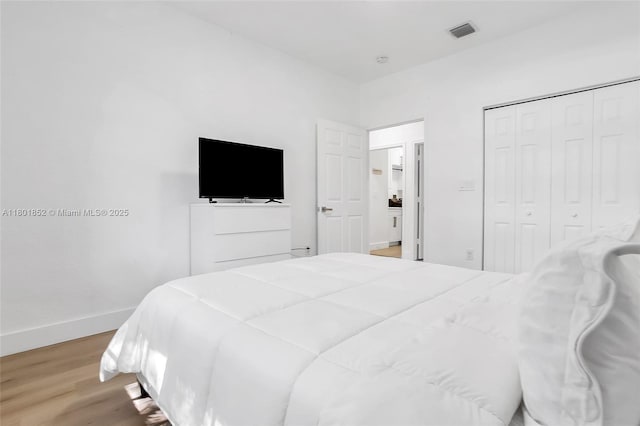 5530 SW 195th Ter, Southwest Ranches, FL 33332 - bedroom with light wood finished floors, baseboards, and a closet