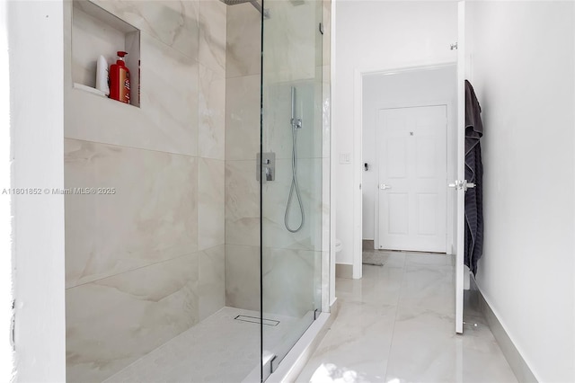 5530 SW 195th Ter, Southwest Ranches, FL 33332 - full bathroom featuring a tile shower, marble finish flooring, baseboards, and toilet