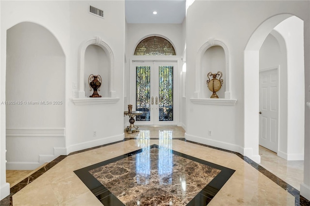 18900 SW 32nd Ct, Miramar, FL 33029 - foyer featuring inlaid floor details, marble tiled floors, french doors, baseboards, and recessed lighting