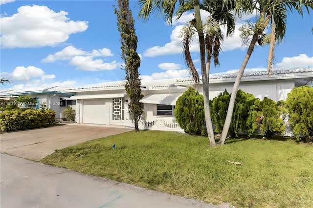 5706 NW 81st Ave, Tamarac, FL 33321 - single story home with a garage, a front lawn, concrete driveway, and a tiled roof