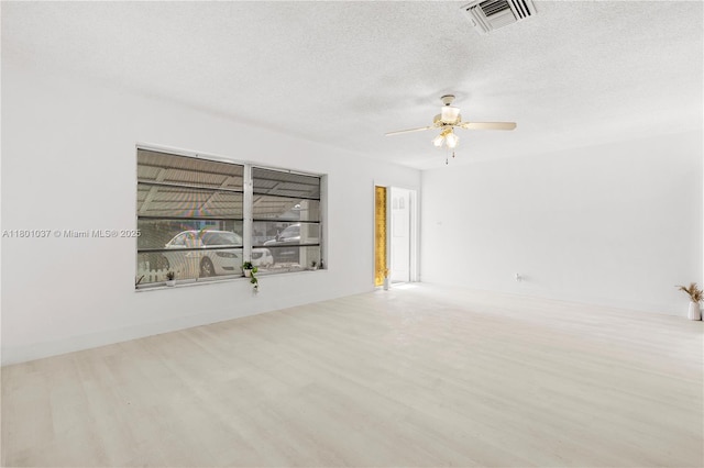 5706 NW 81st Ave, Tamarac, FL 33321 - unfurnished room with wood finished floors, ceiling fan, and a textured ceiling