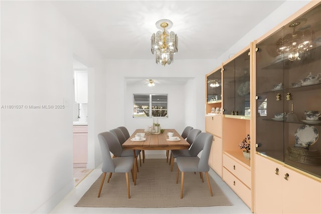 5706 NW 81st Ave, Tamarac, FL 33321 - dining space featuring a chandelier, light tile patterned floors, and a ceiling fan