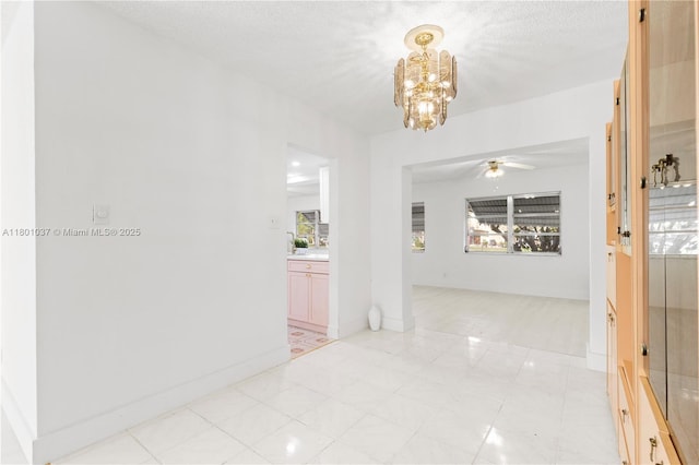 5706 NW 81st Ave, Tamarac, FL 33321 - hall featuring a chandelier, healthy amount of natural light, and baseboards