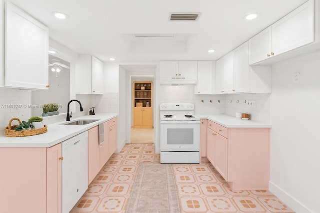 5706 NW 81st Ave, Tamarac, FL 33321 - kitchen featuring white appliances, under cabinet range hood, a sink, decorative backsplash, and recessed lighting